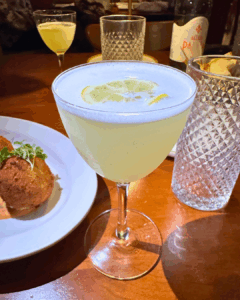 Lemon drop martini served in a coupe glass at an Italian restaurant