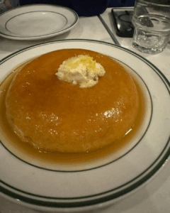 Thick honey butter pancakes served on a white plate