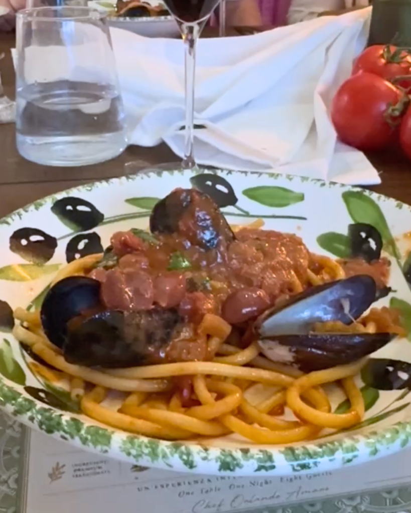 Homemade bucatini alla puttanesca with mussels, Taggiasca olives, anchovies, and tomato sauce at Amaro Supper Club.